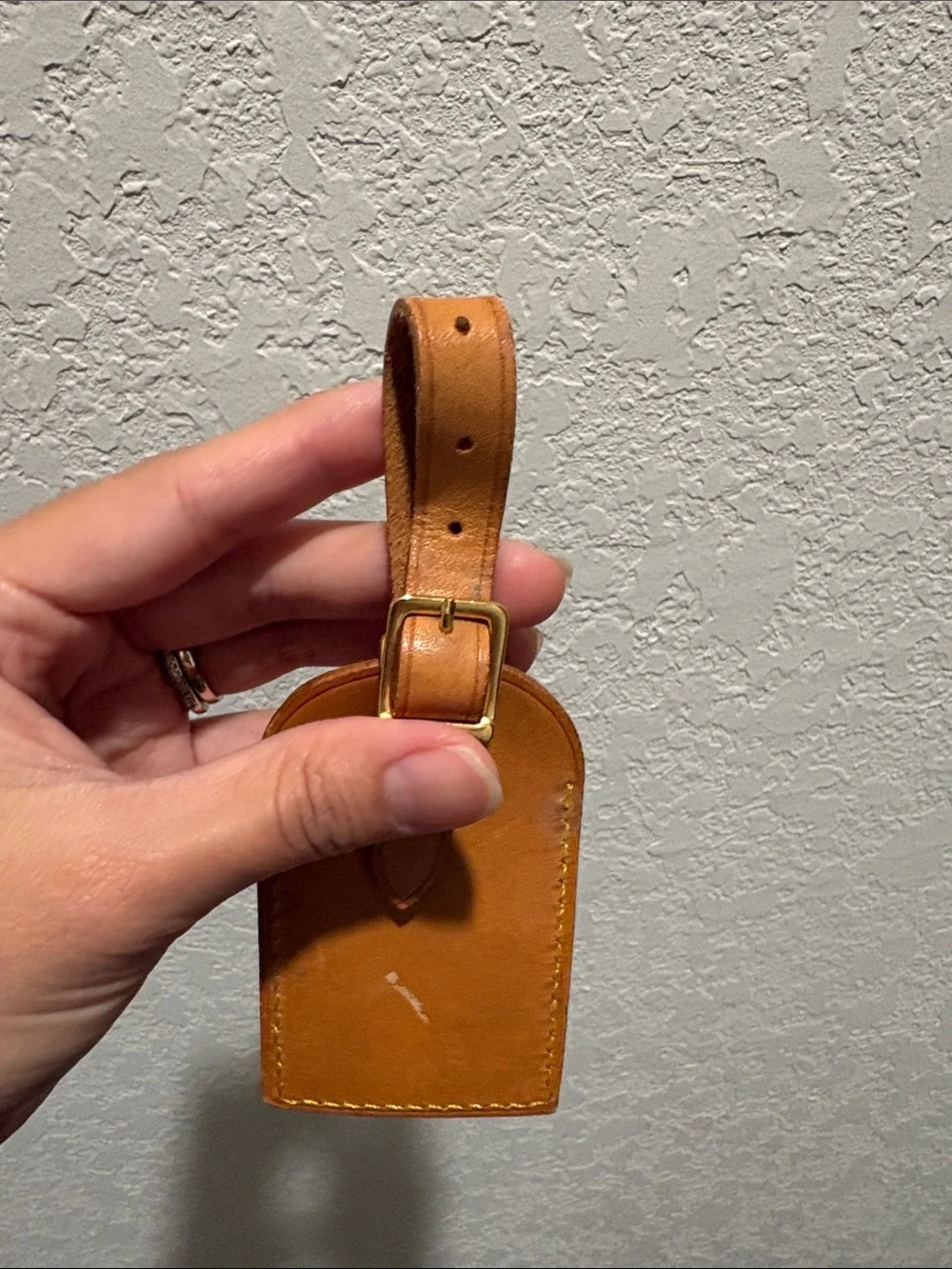 Louis Vuitton leather luggage tag.